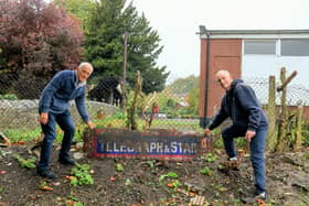 Keith Twiss and Alan Bews discovered the vintage sign whilst clearing Mr Twiss' garden
