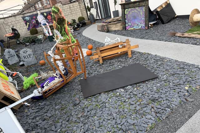 Smashed skeletons and wrecked witches littered the yard after the storm
