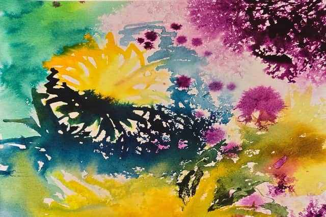 A vibrant watercolour of sunflowers in bright yellow, green and purple tones
