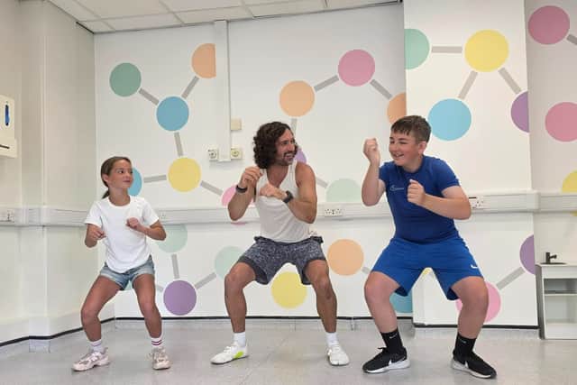 Orla and Harrison with Joe Wicks filming a new series of videos