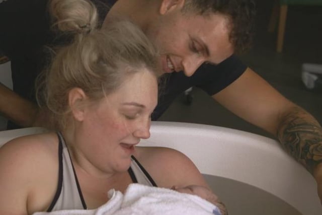 Kayleigh Birch and Adam Crossley admiring their new born baby Rosie