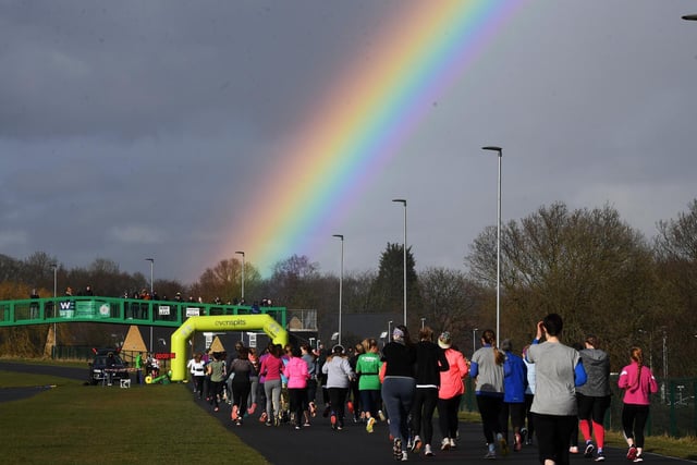 A stunning rainbow as runners head towards the start and finish.