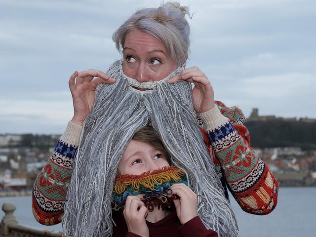 Ollie Burton Hill peeps through the long beard of Lucy McGuire.