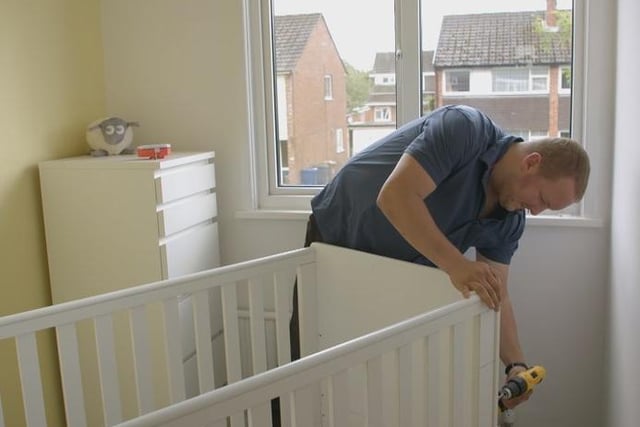 Tony Stirzaker at his home making a cot for his new born