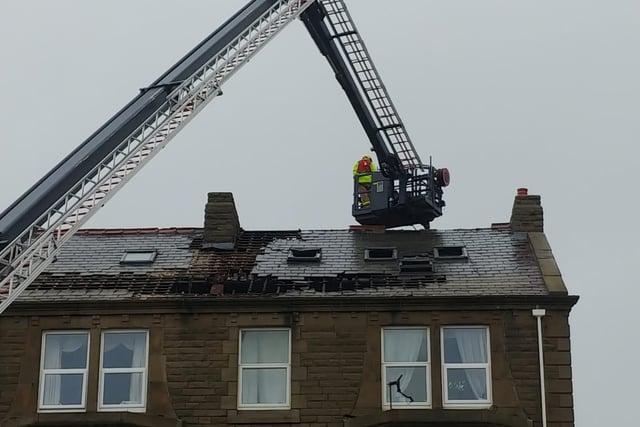 Firefighters were forced to a number of roof tiles to prevent the blaze from spreading