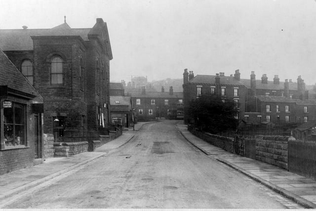 Looking up Branch Road, possibly taken from the bridge. On the left is a small shop, Broughton's Ironmongers, then the United Methodist church, a typical Wesleyan building. Next to that is Frank Hartley's tailors.