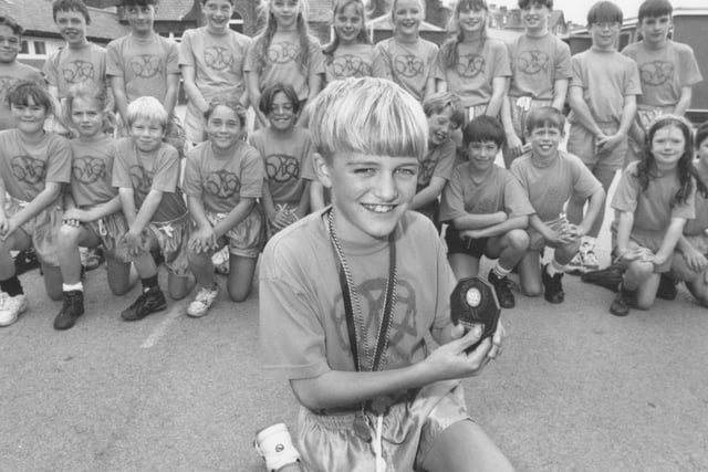 Medal winner Gary Smith is pictured with other members of the Gladstone Road Junior School cross country teams back in October 1994. Can you put any names to faces?
