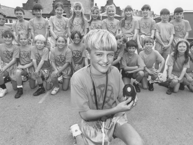 Medal winner Gary Smith is pictured with other members of the Gladstone Road Junior School cross country teams back in October 1994. Can you put any names to faces?