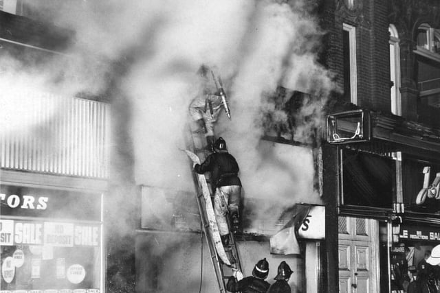 Firefighters fight a blaze which destroyed a sports store in Leeds city centre.  Around 50 pupils at a nearby school of music were evacuated as fire crews batled  the flames.