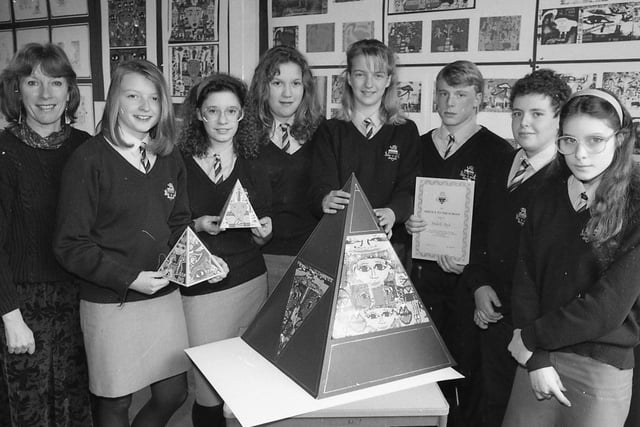 Seven Garstang High School pupils have received certificates marking their service to the school in pioneering computer graphics technology. Pictured above is arts teacher Lona Bond with computer pupils Michelle Boyd, Amanda Hogg, Shana Henriques, Emma Grant, Martin Ashton, Peter Davis and Cheryl Gallagher