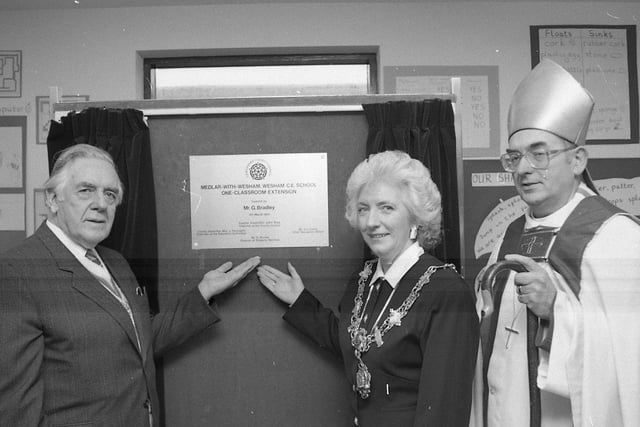 The official opening of a 66,000 classroom will be tastefully celebrated with the cutting of a massive cake. Former Lancashire County Councillor George Bradley performed the opening honours for the Wesham CE Primary, of Garstang Road North. The Rt Rev Alan Chesters, Bishop of Blackburn, conducted a dedication. They are both pictured above with the Mayor of Fylde Coun Eileen Hall