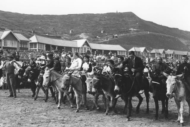 The starting line of a donkey race on the beach in around 1913.