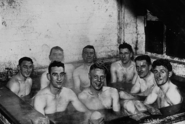 Scarborough footballers take a seaweed bath in preparation for an FA Cup match on November 26 1937.