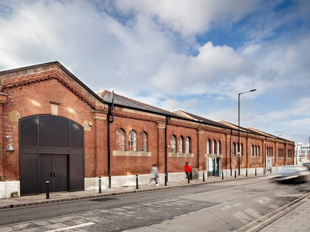 Doncaster Enterprise Market, by Bond Bryan. Grade II-listed structure has been used for market stalls which, prior to this refurbishment, had fallen into disrepair. New stalls are connected with the civic public realm outside - drawing the visitors into the central heart of the Wool Market space with a horseshoe shape of food stalls, arranged around a central eating space. Photo: Philip Grayston