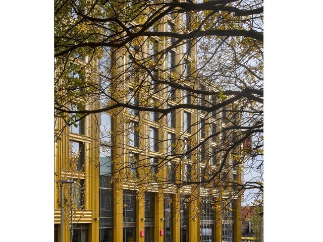 St Albans Place, Leeds, by Feilden Clegg Bradley Studios. Drawing on Leeds' traditional ceramic and textile industries, the building faade is expressed as a woven pattern of glazed bronze ceramices. Photo: Will Pryce