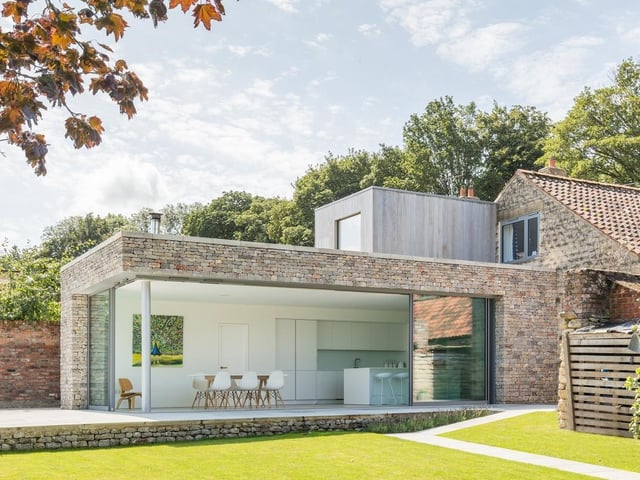 The Old School, North Yorkshire, by ArkleBoyce Architects. A Grade II Listed former school that was rebuilt in 1852 and sits within a quiet rural hamlet outside York. A contemporary extension along the southern boundary provides a series of interconnecting spaces with panoramic views of the garden and rural landscape. Photo: Nicholas Worley