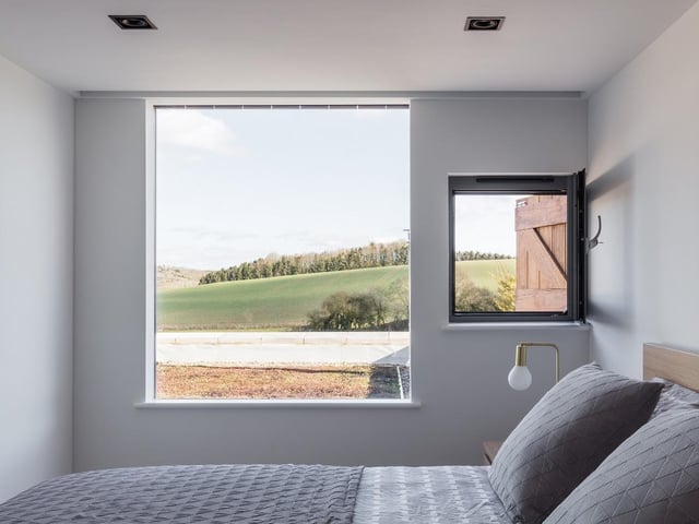 The Old School, North Yorkshire, by ArkleBoyce Architects. To the first floor, a modest intervention of a frake timber-clad box provides an additional bedroom and ensuite. Photo: Nicholas Worley
