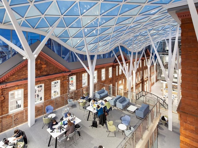 University of Sheffield, Engineering Heartspace, by Bond Bryan. The quadruple-height atrium offers highly-serviced laboratories, offices and a caf - as well as providing a collaboration space for students and staff from various departments. Photo: Philip Grayston
