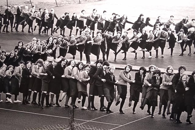 Pupils at Elmslie Girls School do the conga in the school grounds to raise money for the school chapel in December 1982