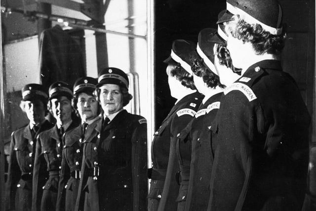 December 1966 and the West Riding's first four women to be employed as traffic wardens wear their uniforms for the first time at the constabulary's tailoring department in Wakefield.