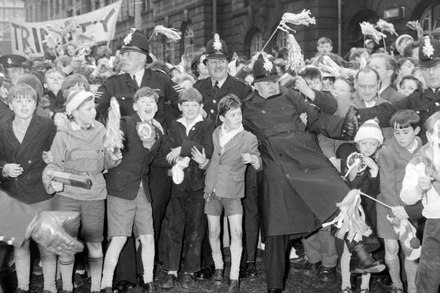 Wakefield Trinity fans celebrate after the club won its their fourth Challenge Cup in 1962. They beat Huddersfield 12-6 in the final.