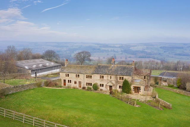 This detached country house with panoramic views over Wharfedale has five bedrooms and planning applications for three detached dwellings.