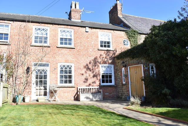 The period features and character of the cottage blend seamlessly with the stunning cozy reception rooms and amazing kitchen extension to the rear which creates a fantastic central entertaining hub.