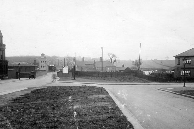 A view down Station Road towards bridge over L N E R with Cold Well Road on the right (now Coldwell Road). Before the bridge, on the left, is The Station Hotel. Across the bridge is the cinema called The Picture House.