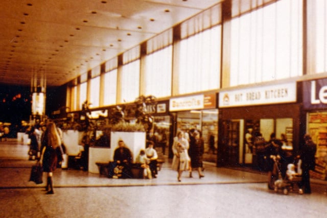 The Arndale Shopping Centre on Station Road. Shops visible include Leyland Paint and Wallpaper Ltd, the Hot Bread Kitchen and Bancrofts Cards.