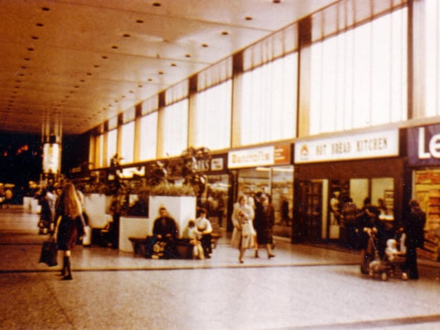 The Arndale Shopping Centre on Station Road. Shops visible include Leyland Paint and Wallpaper Ltd, the Hot Bread Kitchen and Bancrofts Cards.