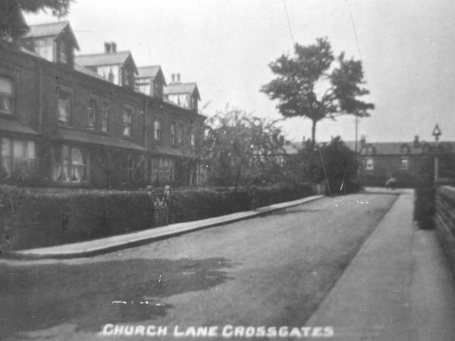 Looking north along Church Lane. In the distance Church Lane bears left by the junction with Sandbed Lane. Another row of terraced houses, Roseville Terrace, faces the camera on the right.