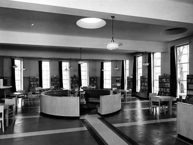 The childrens area at Cross Gates Library with central circular seating. The round ceiling lights were a noted architectural feature of the building.