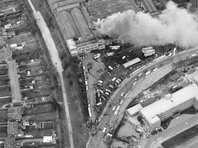 An aerial view of Cross Gates Carriage Works on Manston Lane. A small fire is being attended to by several engines. Nine metro buses worth 120,000 pounds each had to be pushed to safety.