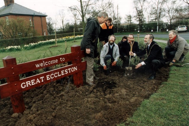 Visitors to Great Eccleston will receive a warmer welcome thanks to a new sign. Councillor George Roper, the mayor, plants the first shrub next to it in April 1992