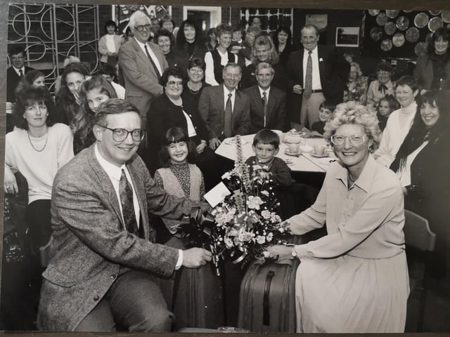 Teacher at Lindhead School Stephen Syers, left, presented Doreen Brooke with suitcases and flowers for 20 years service at the school as Deputy Head back in December 1994. Doreen was leaving the school and planned to travel. She is pictured with schoolchildren, parents and teachers.
