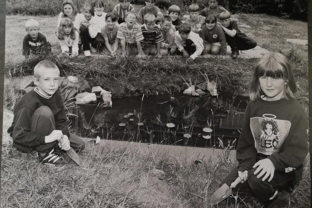Starting work on a new wildlife pond at Hinderwell School in July 1995 were pupils Matthew Allen (front left) and Nicola Payne (front right). Looking on are their classmates who were also involved in the project.