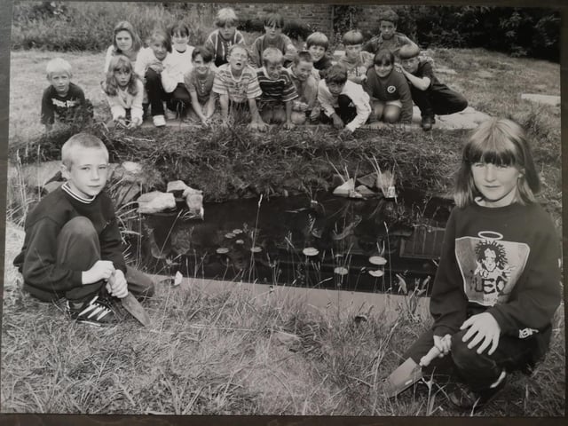 Starting work on a new wildlife pond at Hinderwell School in July 1995 were pupils Matthew Allen (front left) and Nicola Payne (front right). Looking on are their classmates who were also involved in the project.