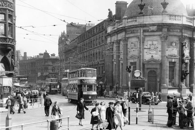 Trams on Boar Lane in 1947.