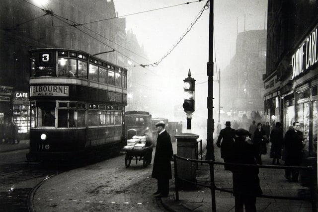 A smog filled night on Boar Lane as a Roundhay tram makes slow progress.