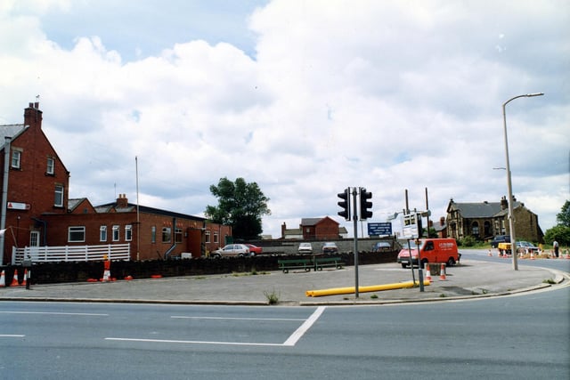 Bruntcliffe Road showing the junction with Howden Clough Road on the right. On the left is Bruntcliffe Working Men's Club.