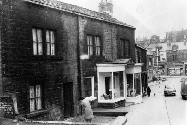 A view of houses and shopfronts on Chapel Hill, looking towards Morley Bottoms.