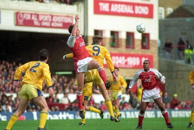 Steve Bould and Lee Chapman challenge for the ball as David Rocastle looks on at Highbury.