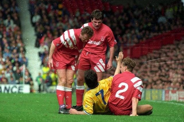 Steve Hodge is hounded by the Reds included Ray Houghton and Steve Nicol.