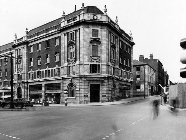 This view shows Electricity Showrooms on The Headrow next to the Tax Offices on the corner. There is an entrance to the Electricity Showrooms also on Albion Street. Pictured in August 1939.