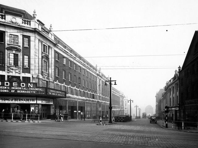 The Headrow, looking east from the junction with Briggate towards Eastgate. Prominent in the photo is The Odeon cinema, which is showing "The Song Of Bernadette". Pictured in November 1944.
