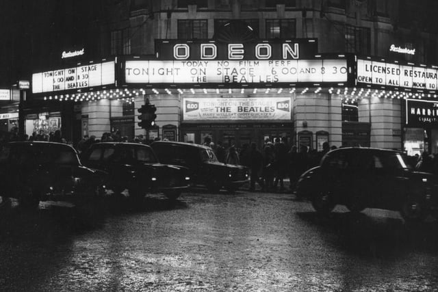 The Odeon Cinema at the junction of New Briggate and The Headrow on the night of a performance by The Beatles. This was one of three live performances by the group at the venue.