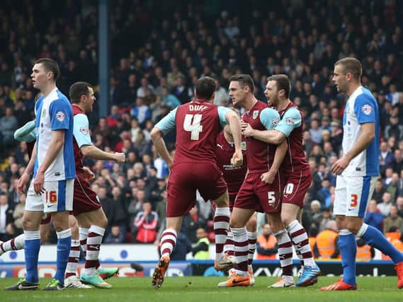 Jason Shackell celebrates his equaliser for Burnley against Blackburn Rovers at Ewood Park in March 2014