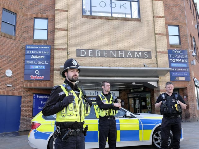 Police on patrol in the town centre.