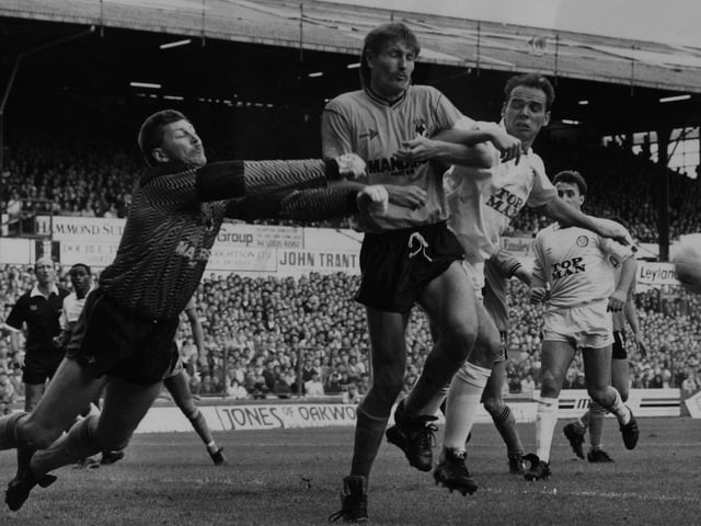 Wolves keeper Mark Kendall punches clear from Mel Sterland and defender Gary Bellamy. A Bobby Davison goal earned the three points.