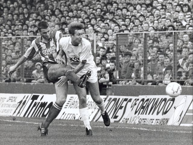 Lee Chapman gets closed down. A goal from John Hendrie and a Gordon Strachan penalty earned the Whites the three points.